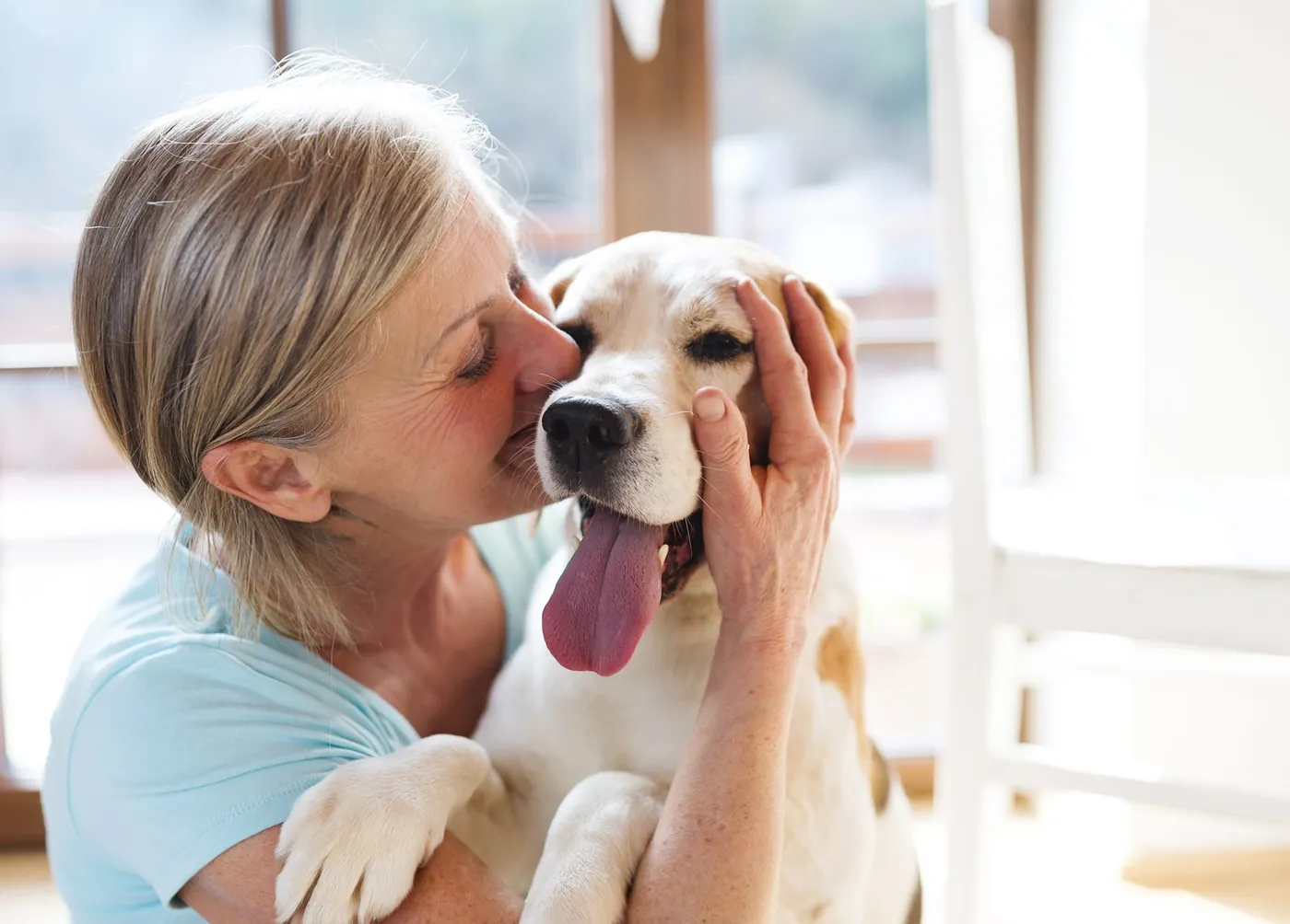 Woman hugging dog